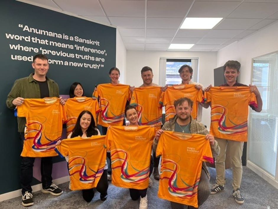 The Anumana team holding up their Magic Breakfast fundraising shirts